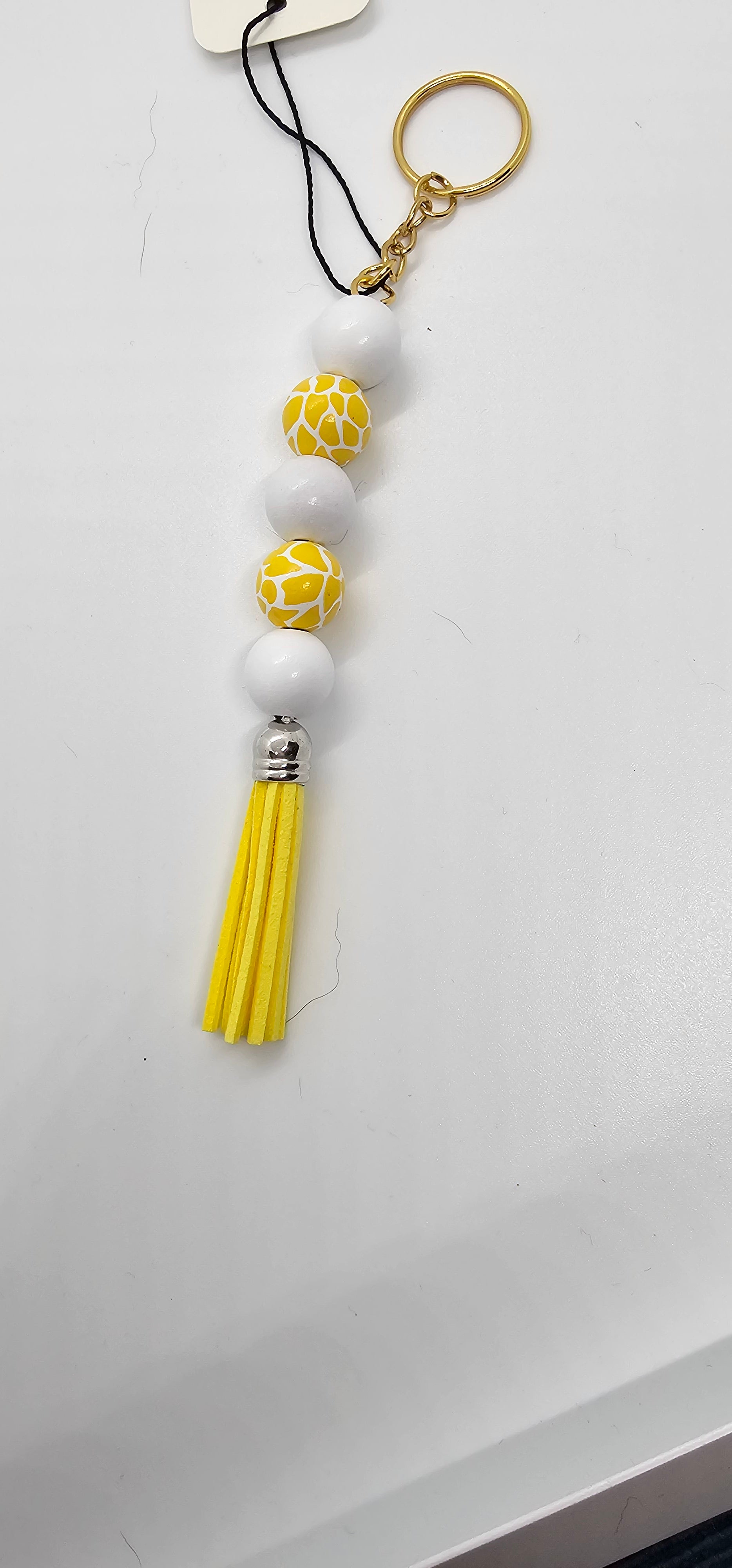White and yellow animal keychain