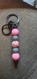 Gray and pink with a wildflower keychain