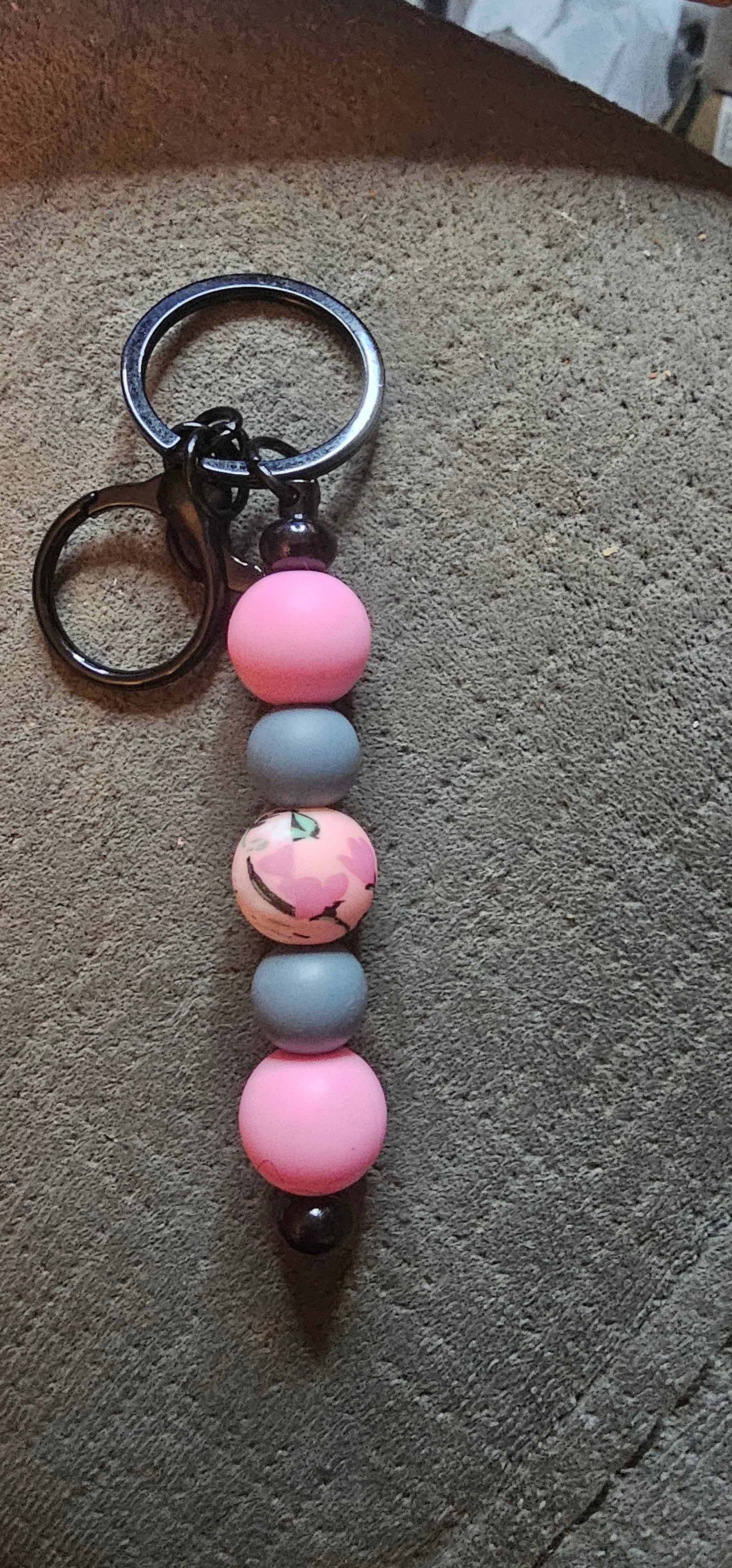 Gray and pink with a wildflower keychain